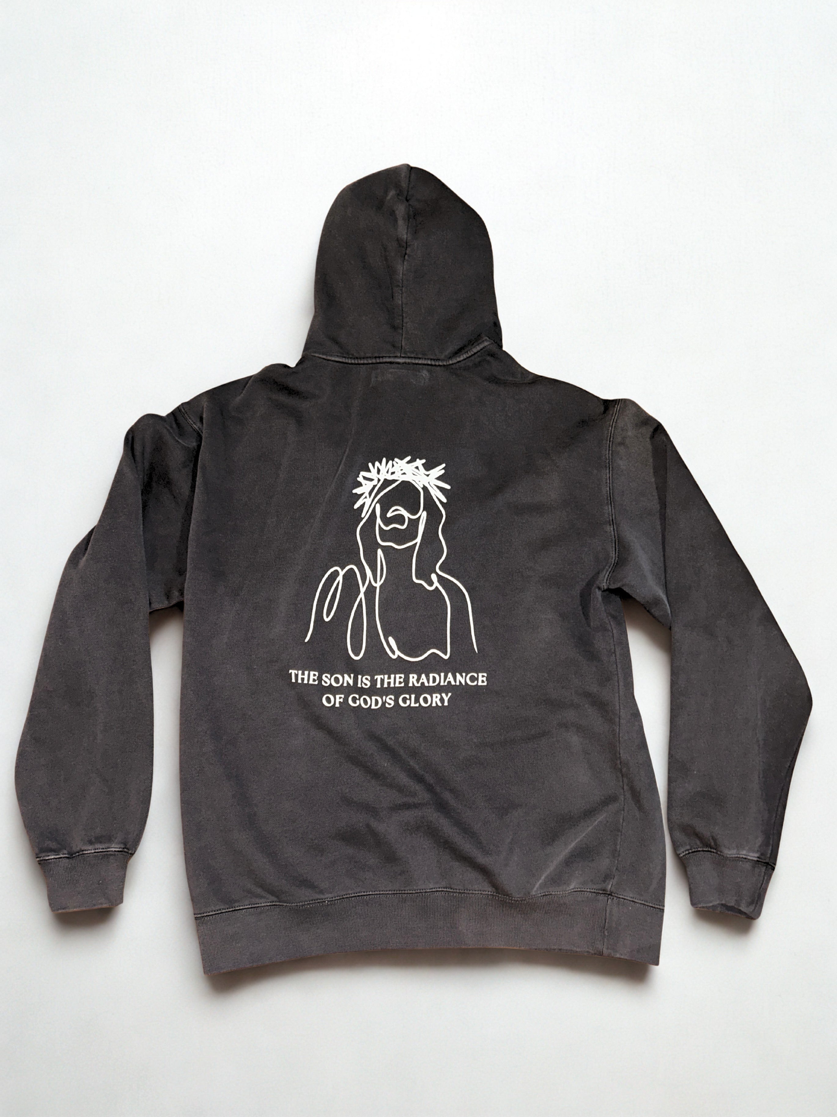 Black hoodie with white graphic design on a white background